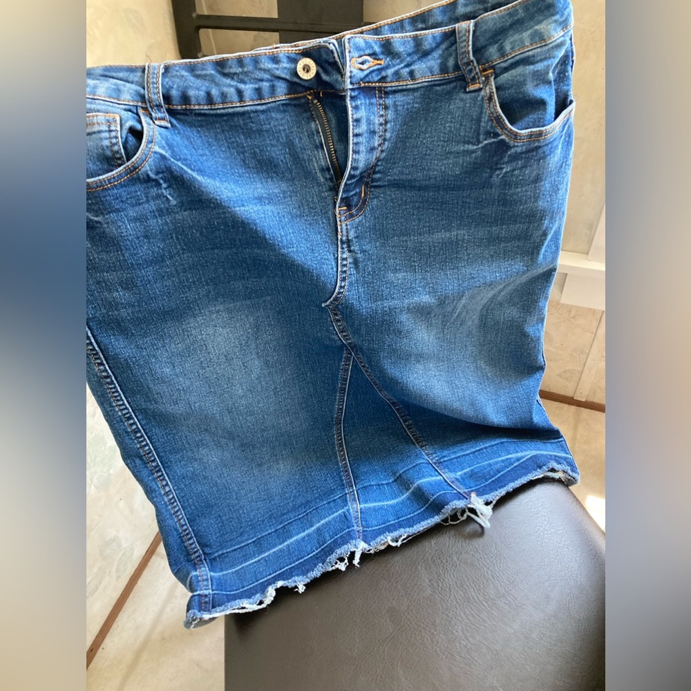 Like new stretchy blue Jean skirt frayed hem.